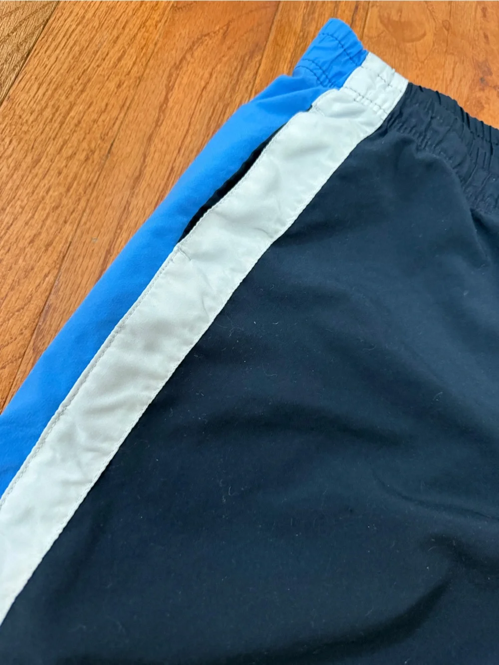 Nike Black Track Pants with Blue Side Stripes